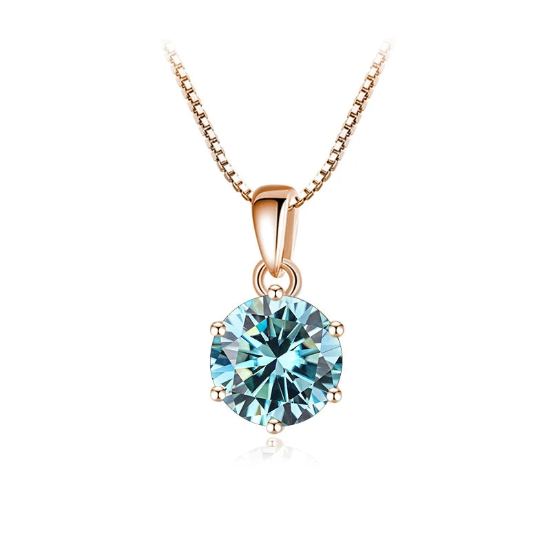 Aquamarine moissanite pendant necklace with rose gold sterling silver chain on white background