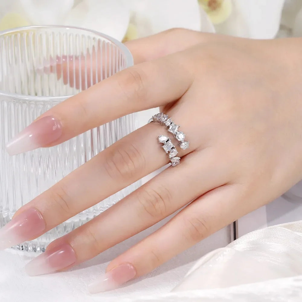 Hand wearing a lab-made moissanite ring with sparkling stones, Moissanright jewelry