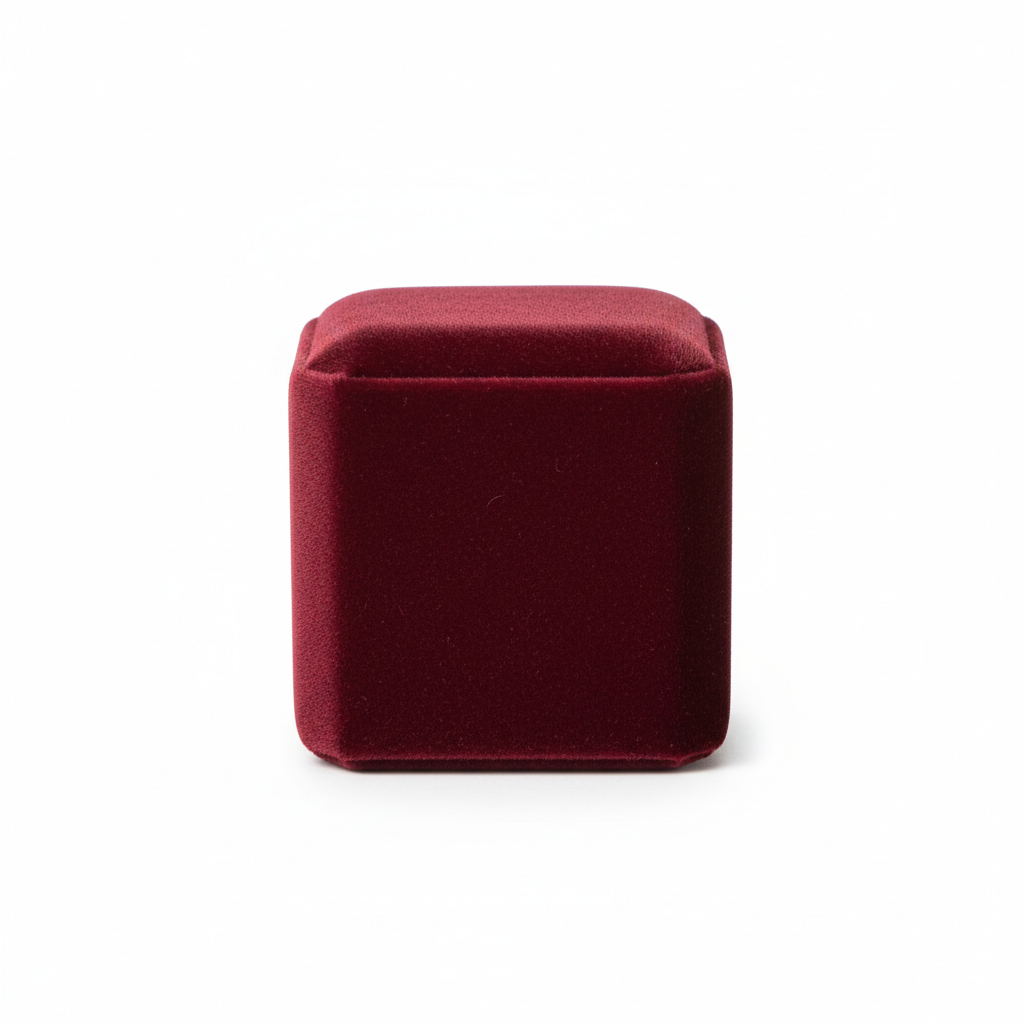 Luxury burgundy velvet cube ring box on white background