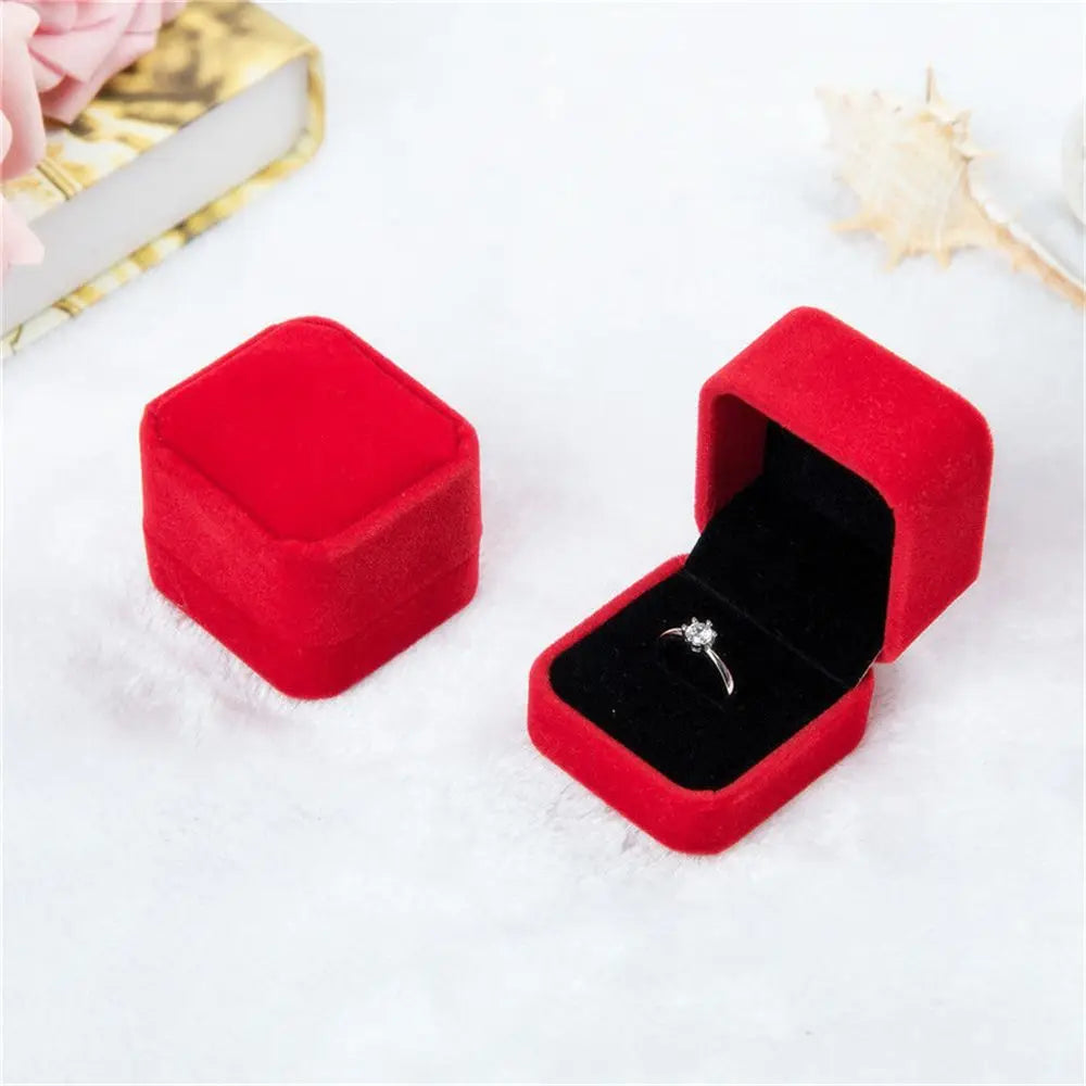 Luxury red velvet ring box – elegant jewelry packaging for proposals, gifts, and anniversaries. Available in 6 colors, perfect for showcasing engagement rings and fine jewelry.