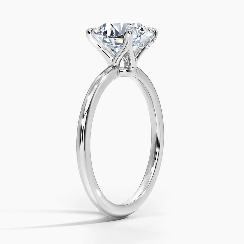 Elegant round cut Moissanite engagement ring in white gold plated sterling silver