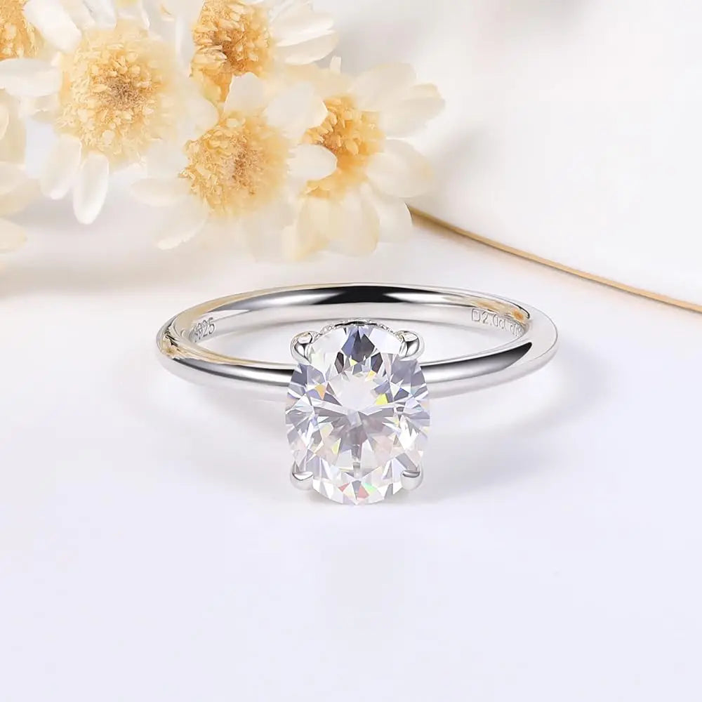 Dazzling oval cut moissanite engagement ring with hidden halo side stone in white gold plated sterling silver size 7. 1 carat, 2 carat, 3 carat, 4 carat