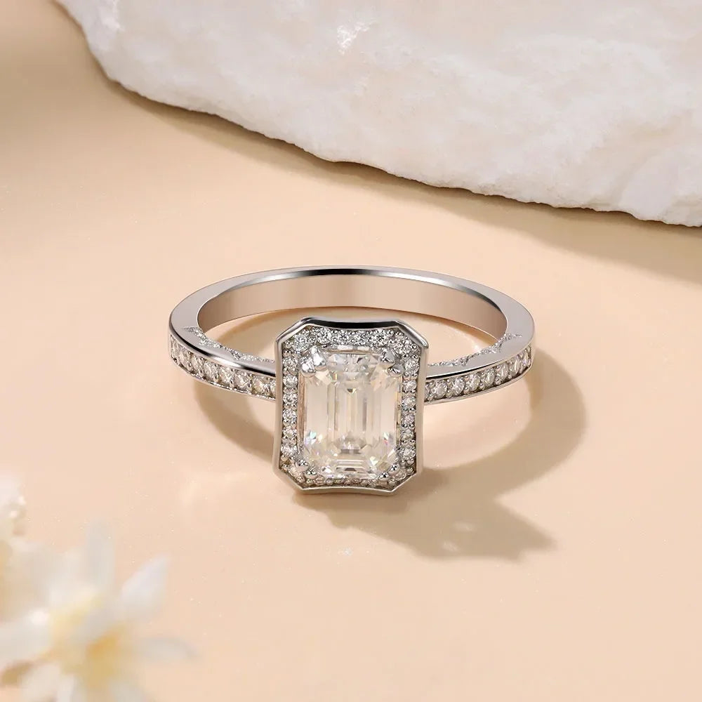 1.25ct Emerald-cut moissanite engagement ring in 18K white gold-plated sterling silver, featuring a D-color VVS1 clarity stone