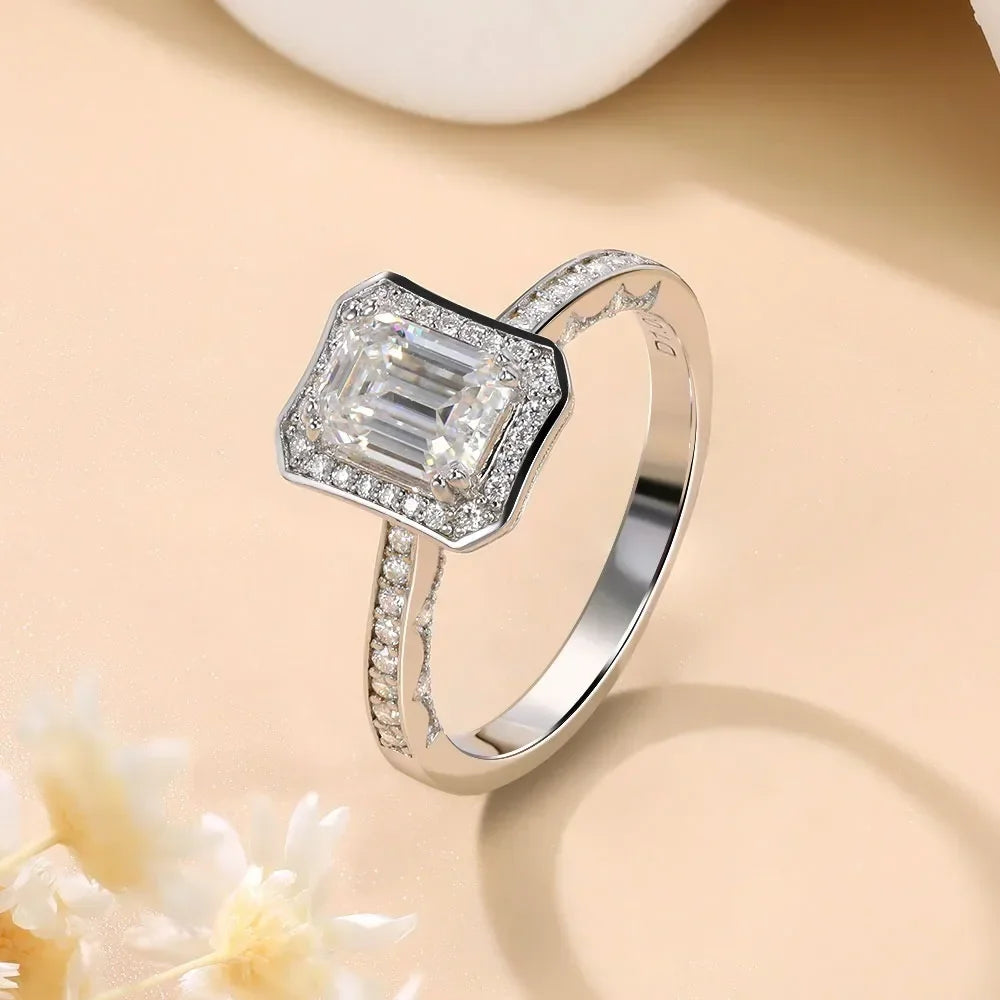 1.25ct Emerald-cut moissanite engagement ring in 18K white gold-plated sterling silver, featuring a D-color VVS1 clarity stone