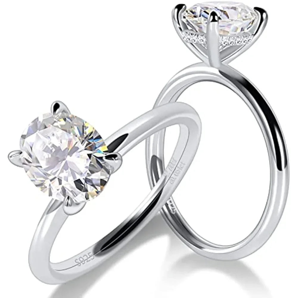 Dazzling oval cut moissanite engagement ring with hidden halo side stone in white gold plated sterling silver